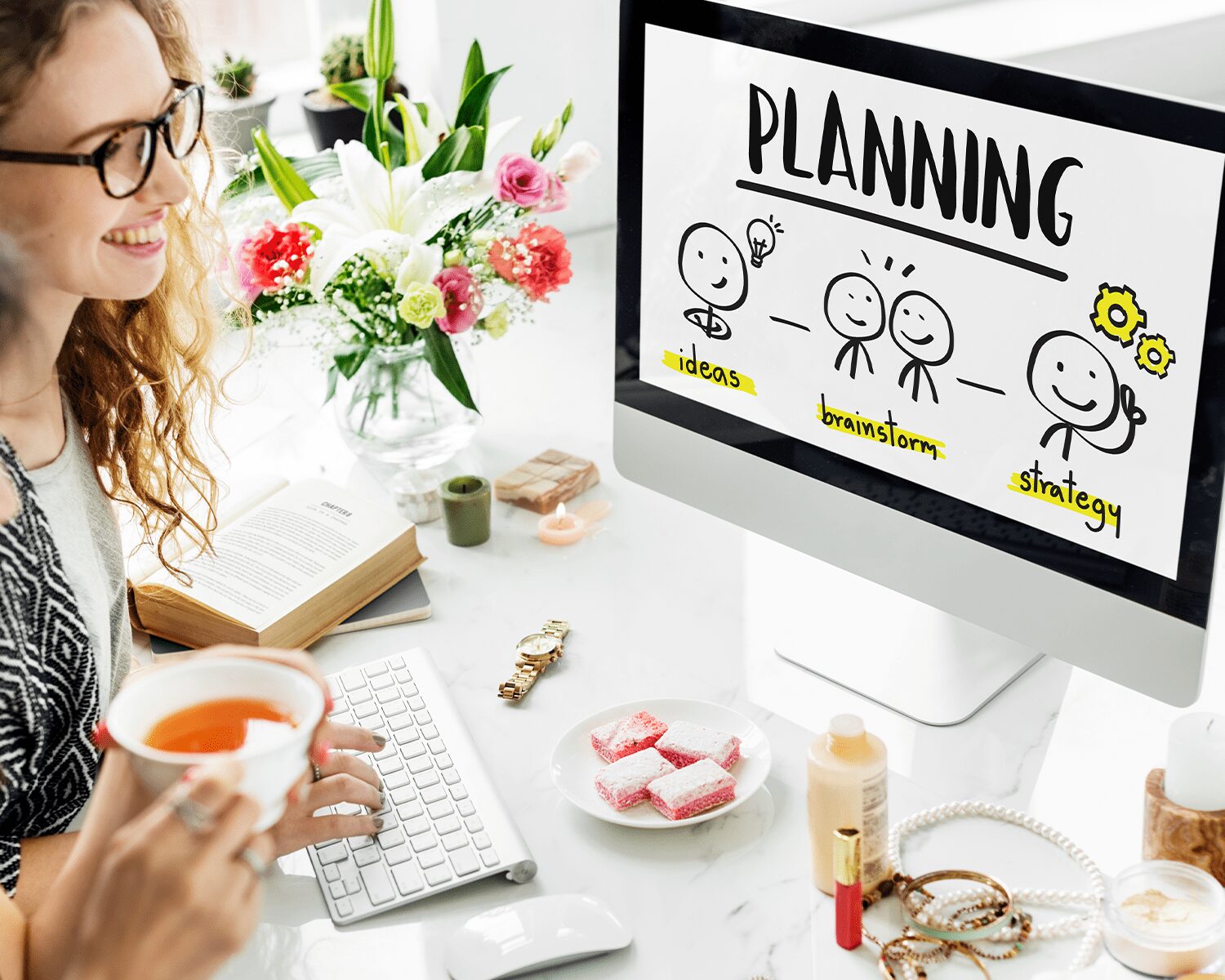 A young woman looking on the computer screen displaying roadmap to Finalize your business concept and action plan