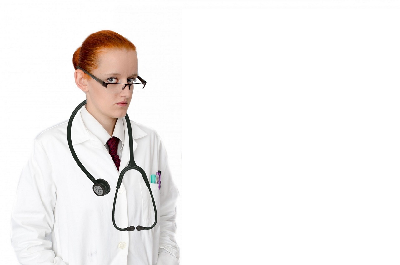 A woman wearing a white lab coat and glasses, representing a professional in a Physician Assistant Firm.