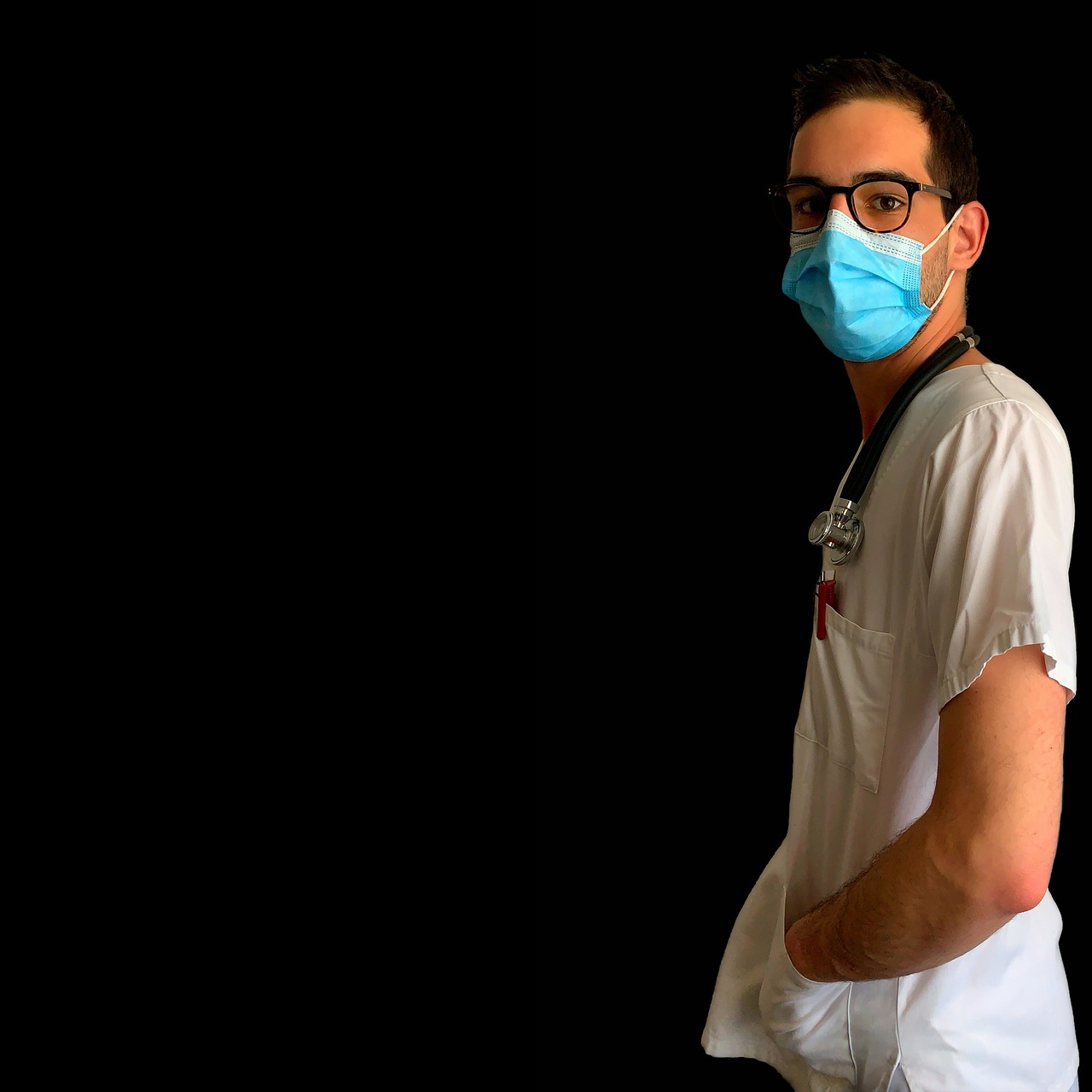 A man in a surgical mask and glasses, representing a nursing and psychiatric care business owner, focused on health and safety.