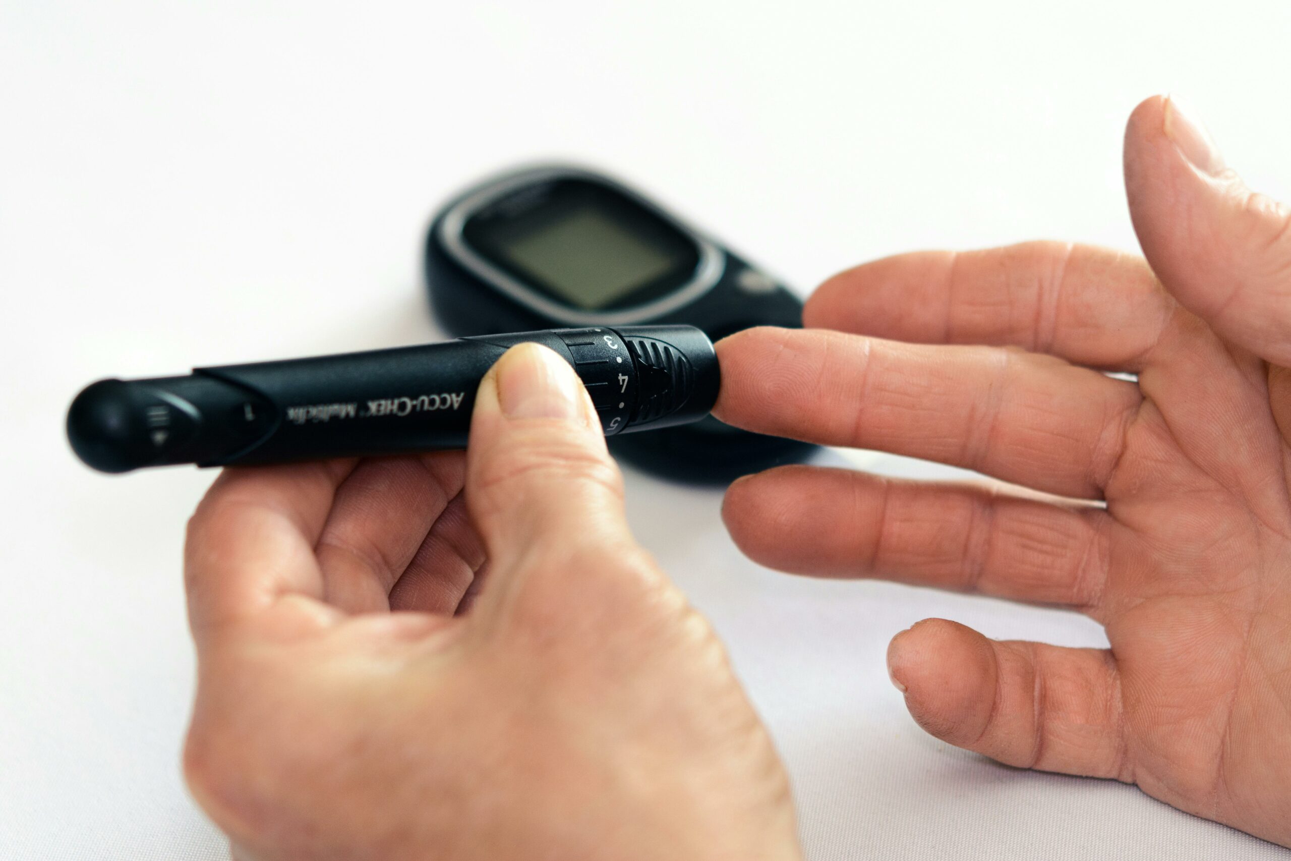 The owner of a diagnostic imaging center displays a small electronic device, emphasizing innovation in medical diagnostics.