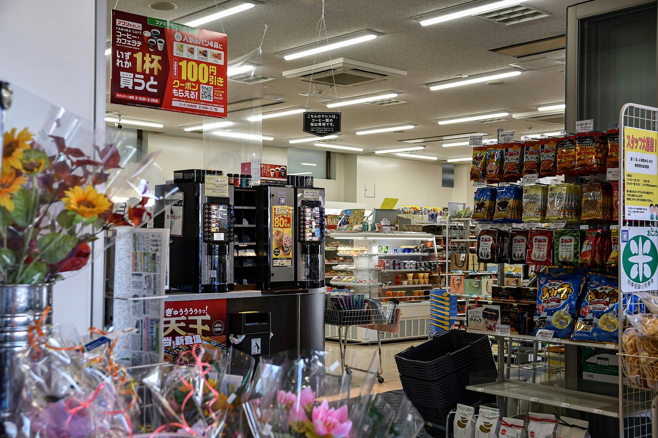 A vibrant store showcasing a vending machine amidst a plethora of flowers, emphasizing utility meter reading services.