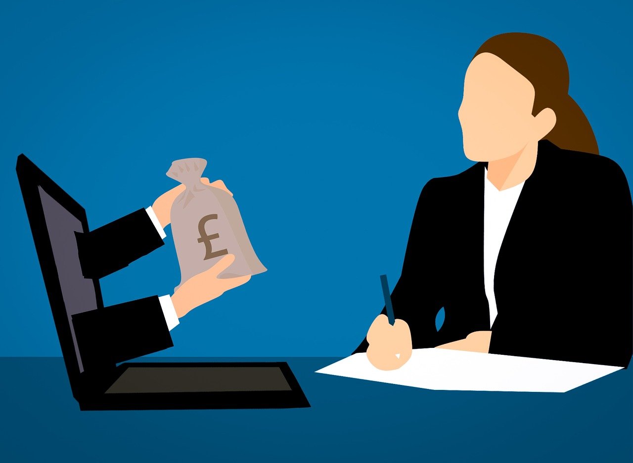 A woman hands money to a man at a desk, representing a transaction in a payroll and timekeeping services business.