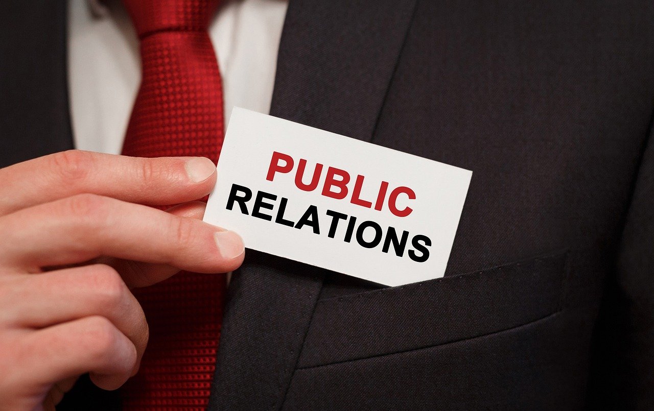 A professional public relations firm owner engaged in strategic communication and media relations activities.