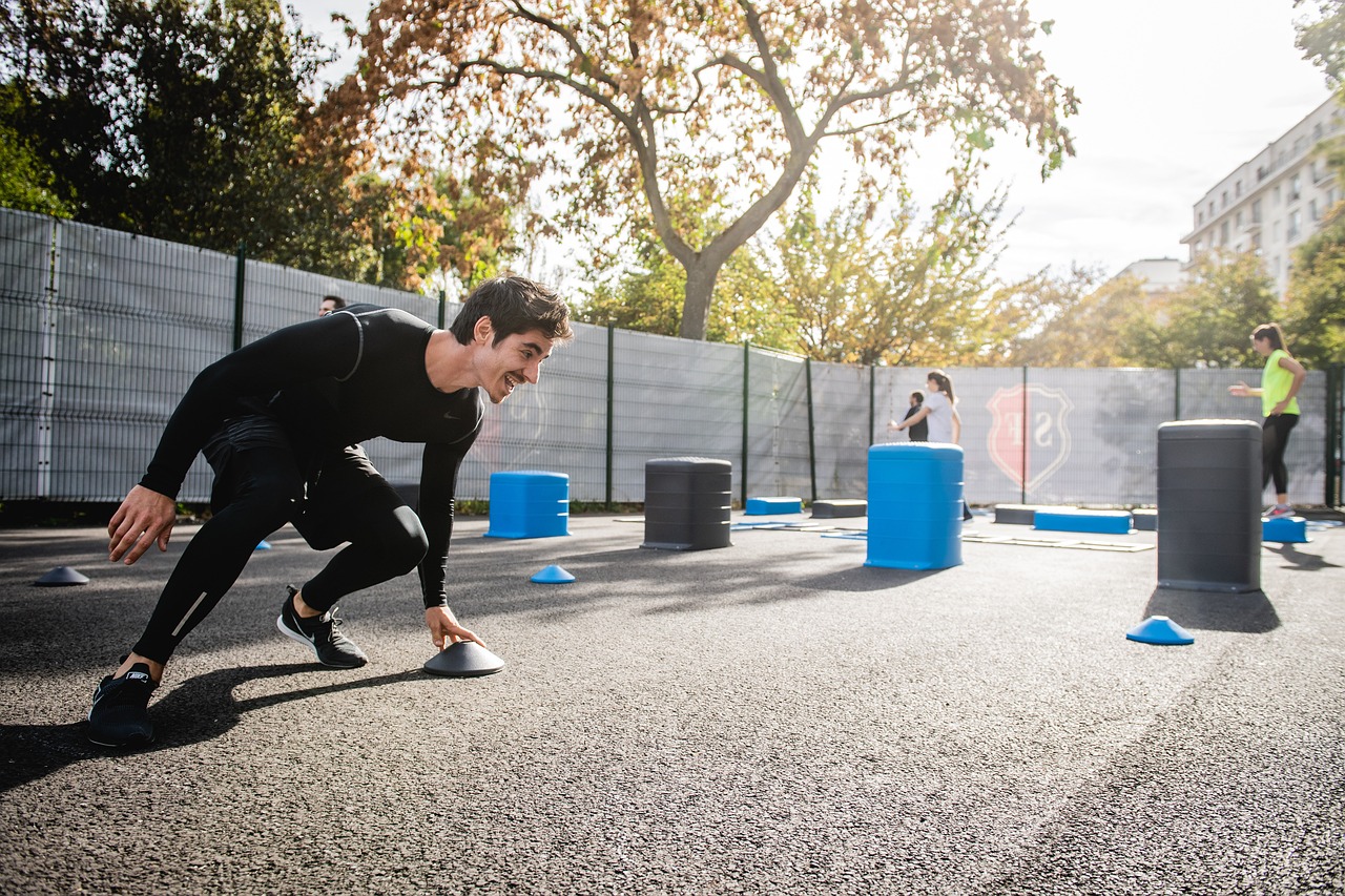 A man sprinting on a basketball court, showcasing athleticism and dedication to fitness in a vibrant sports environment.